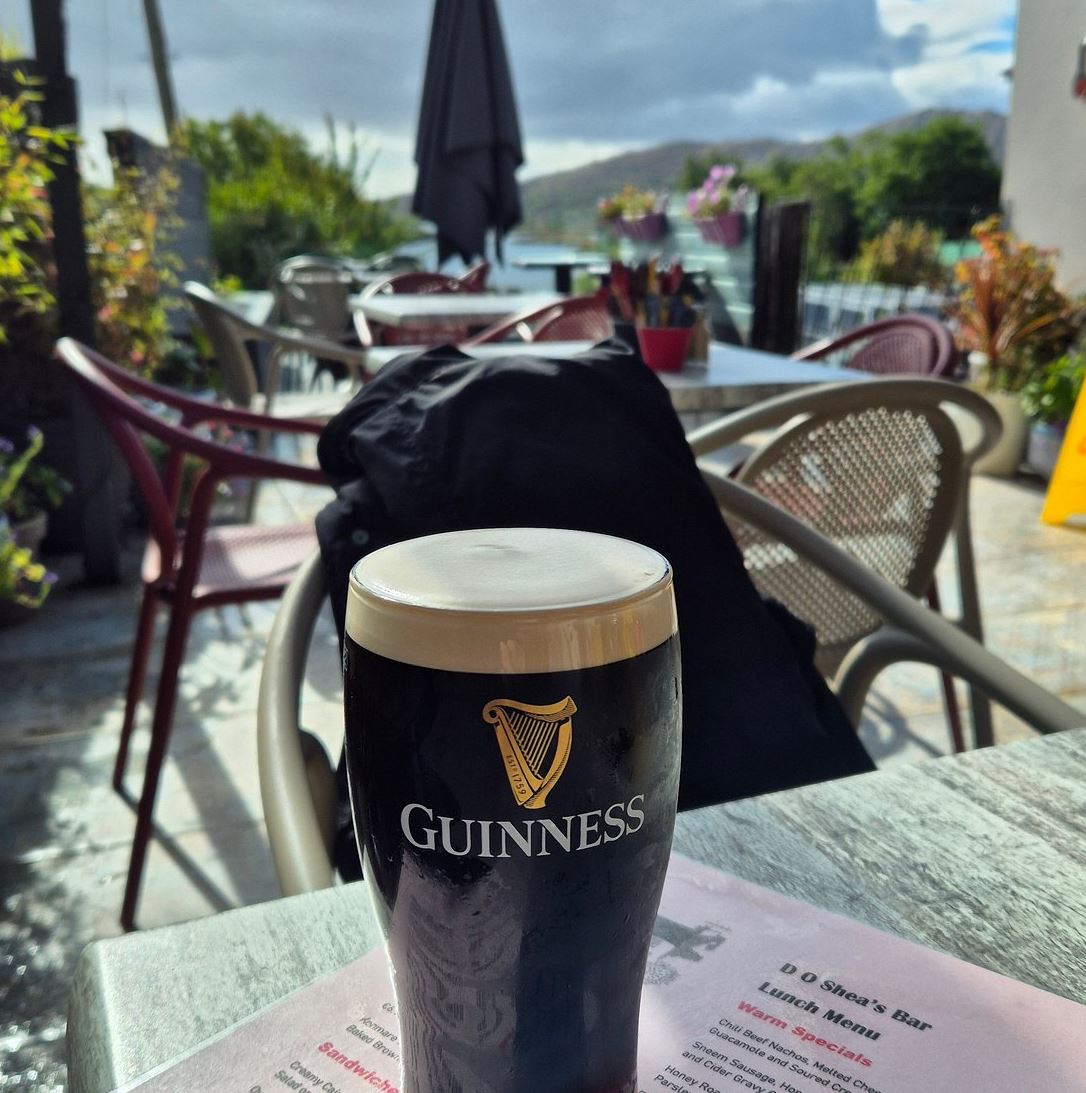 Guinness on the terrace with mountain views